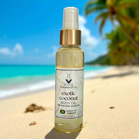 Exotic coconut body oil bottle on a sandy beach with ocean and palm trees in the background