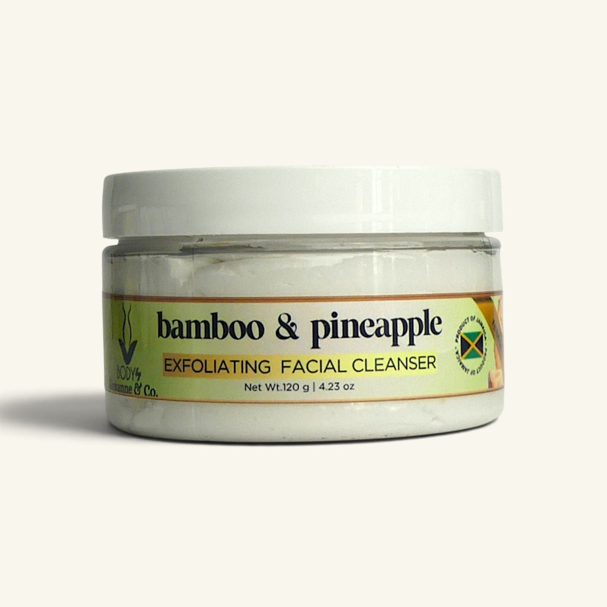 A jar of Bamboo & Pineapple Exfoliating Facial Cleanser by Nature's Way Co., featuring a white lid and a label with green, yellow, and black text, set against a plain off-white background.