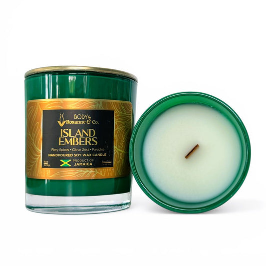 Green candle with a gold label on a white background
