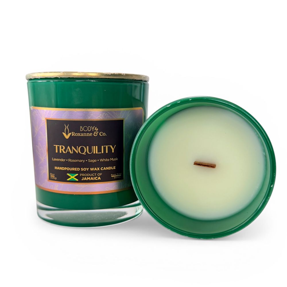 Green candle with a visible label on a white background