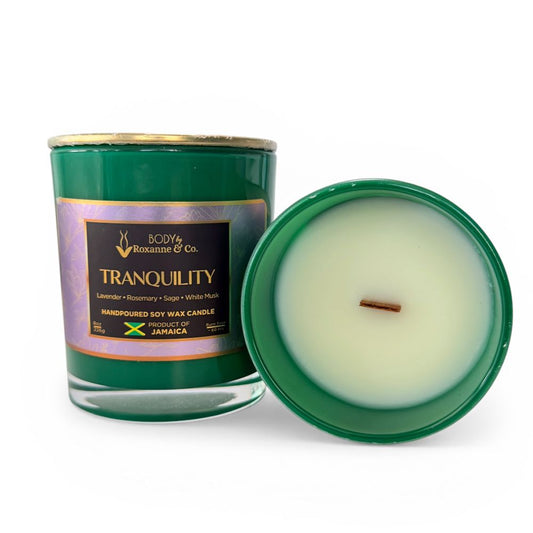 Green candle with a visible label on a white background