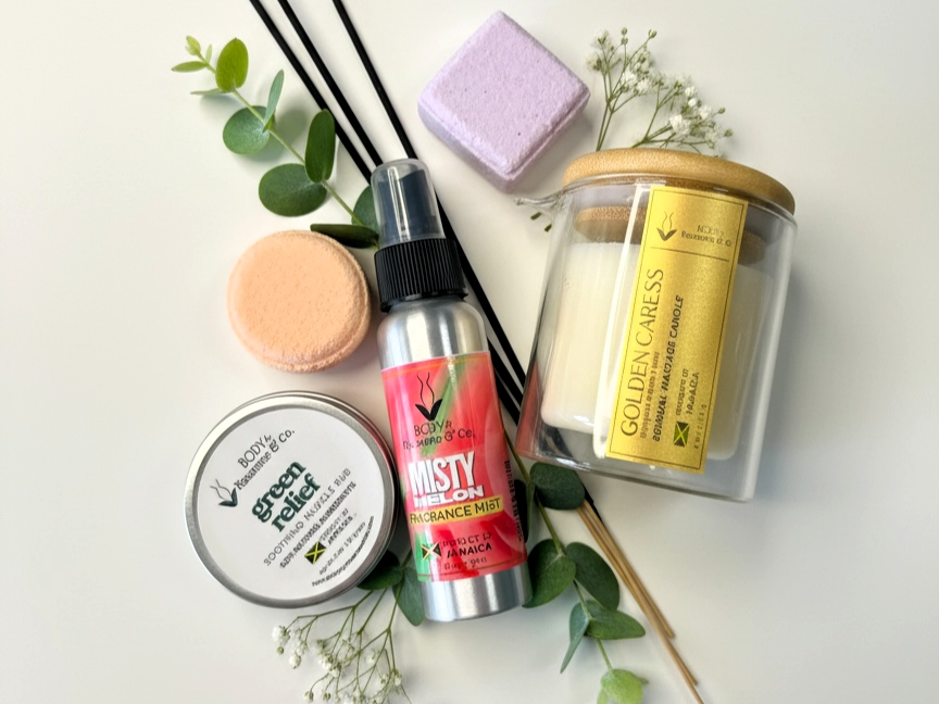 a flat lay of a body spray, a pain relief balm and sticks of incense