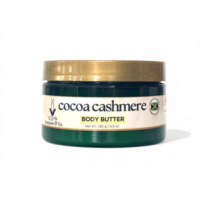 Cocoa Cashmere body butter jar with gold lid on a white background