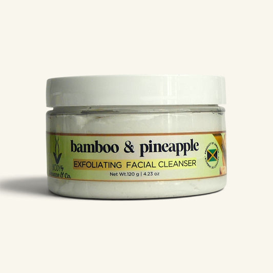 A jar of Bamboo & Pineapple Exfoliating Facial Cleanser by Nature's Way Co., featuring a white lid and a label with green, yellow, and black text, set against a plain off-white background.