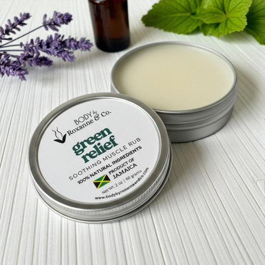 An open of 'Green Relief' muscle rub with a bottle and lavender flowers on a light surface.