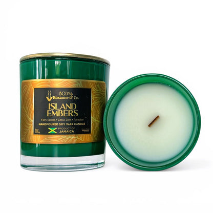 Green candle with a gold label on a white background