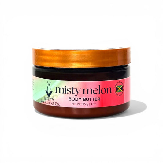 Jar of misty melon body butter with a gold lid on a white background